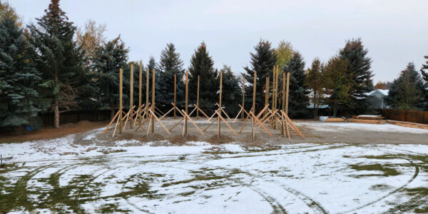 Pole Barn construction with snow on the grass