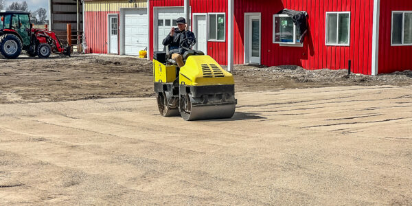 Roller compacting the driveway